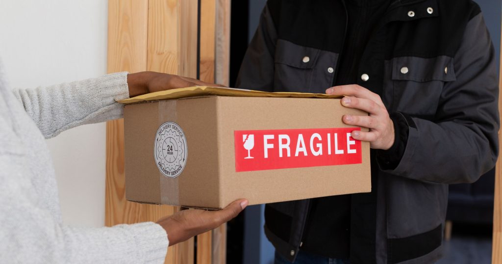 courier delivering parcel client