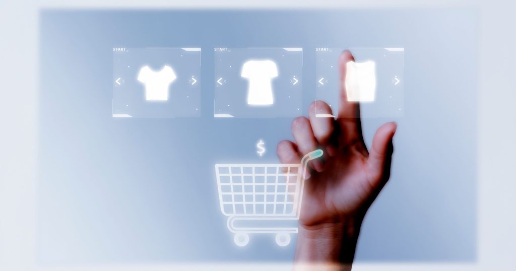 person adding clothes cart online shopping