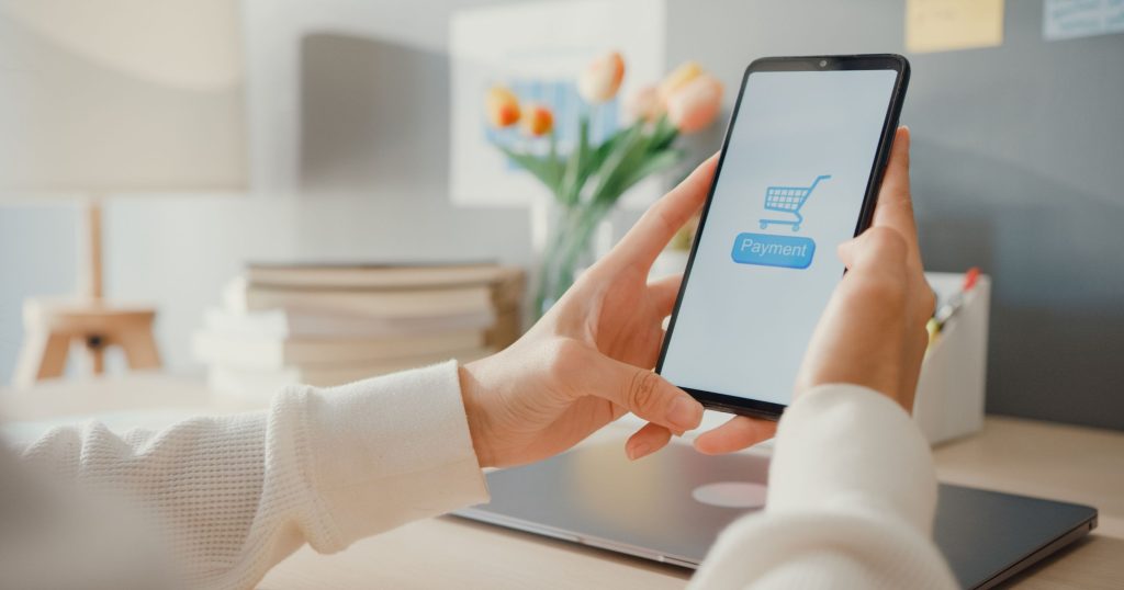 young-lady-use-cellphone-order-online-shopping-product paying bills with banking app transaction