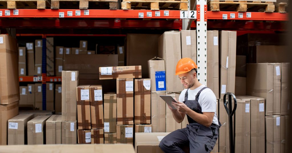 medium shot man sitting warehouse