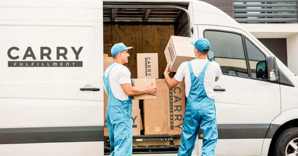 workers unloading boxes from minibus