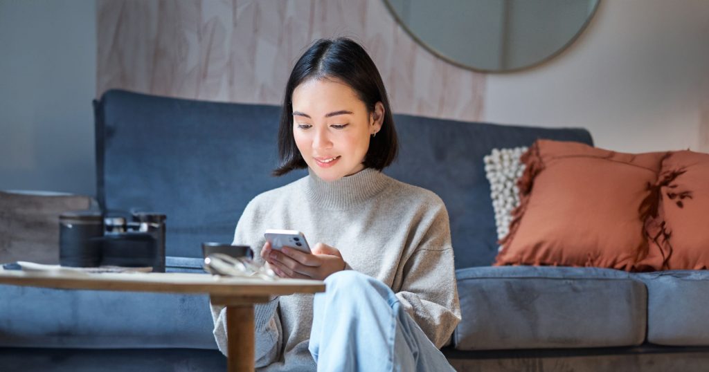 asian woman stay indoor on rainy day