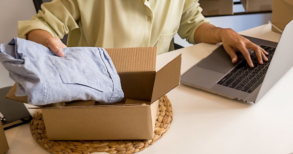online seller packing parcel for delivery
