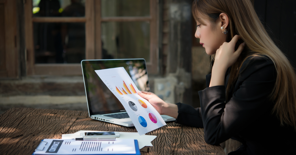 woman analyzing charts planning a blue ocean business strategy
